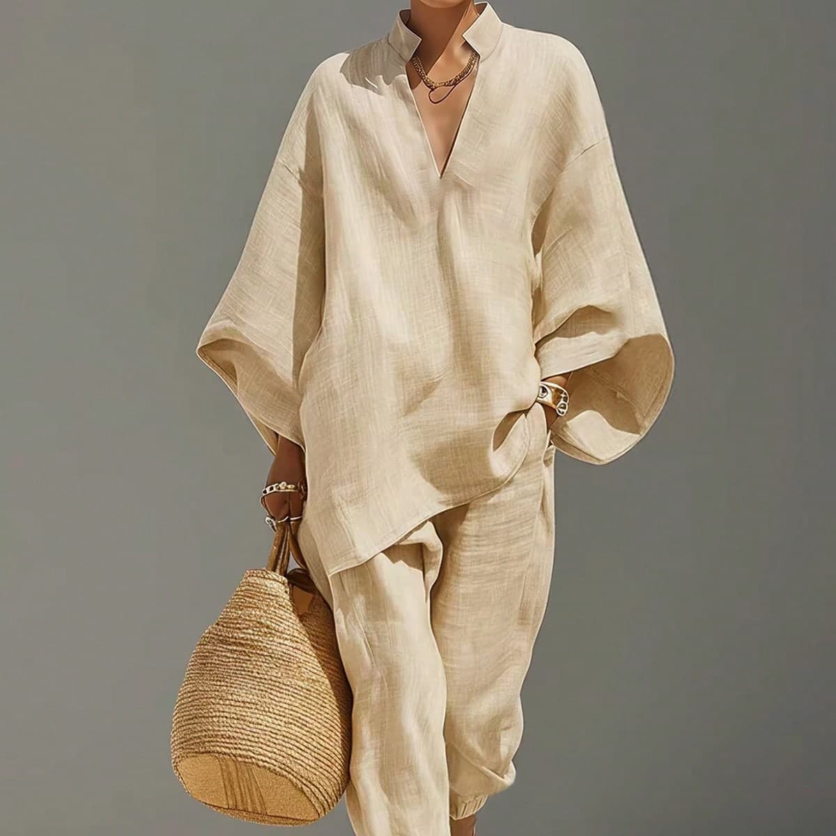 Nuovo set primavera/estate di alta gamma stile francese elegante e chic con top da donna a maniche lunghe con scollo a V + pantaloni casual con vita